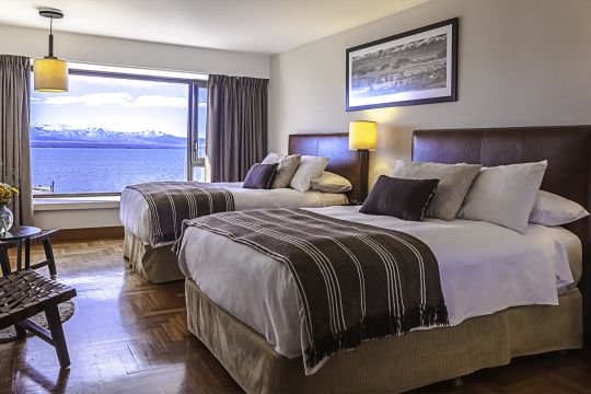 Family Plan with Lake View Fully refurbished rooms that bring out Patagonian tradition and warmth. 27m2 of the utmost comfort with an exclusive view of the Nahuel Huapi Lake.